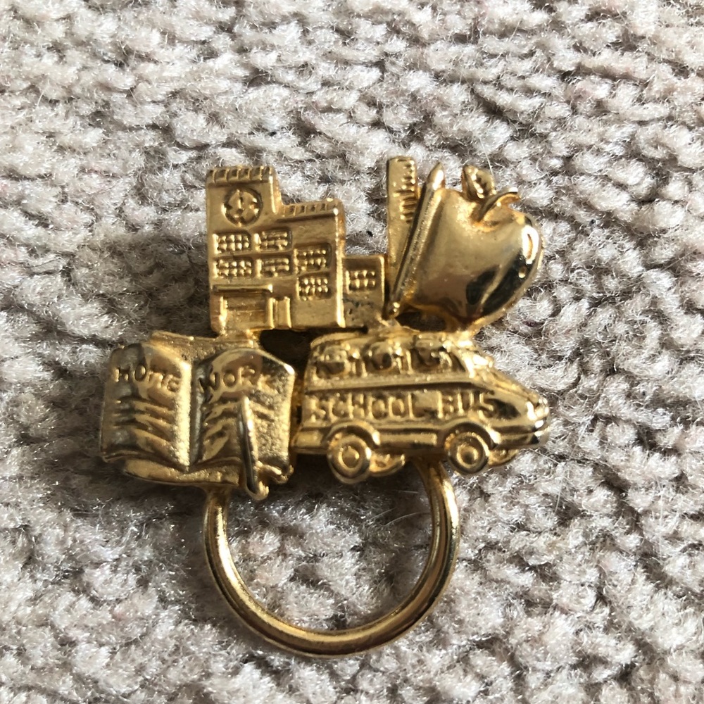 Gold tone teacher pin